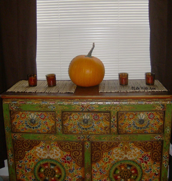 pumpkin and candles on buffet